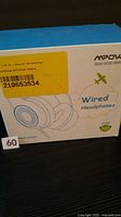 Front of sealed retail box showing Mpow branding and Wired Headphones text