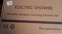 Closed carton labeled Electric Shower Portable Outdoor Camping Shower Set