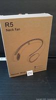 Front of sealed box showing R5 Neck Fan illustration