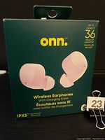 Front of sealed retail box showing pink onn. wireless earphones, IPX5 rating, 36 hrs playtime