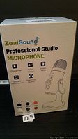 Front of sealed ZealSound Professional Studio Microphone box showing product image and key features