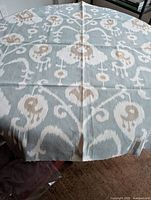 Full view of folded Thomasville ikat fabric piece showing pattern and size