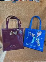 Full view of both Ted Baker tote purses side by side
