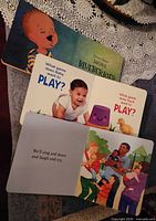 Open board books showing pages and illustrations