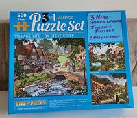 Front of 3-in-1 Village Life box showing three cottage images and 500-piece count