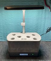 AeroGarden Elite with six-pod insert installed, LED arm extended