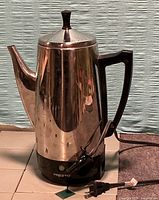 Full view of percolator front with power cord attached