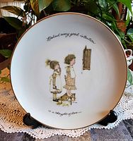 Front view of plate showing artwork and inscription