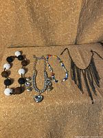 All four necklaces displayed together