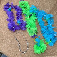 overview of necklace and three leis