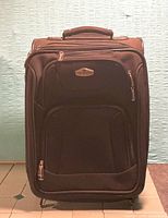 Front view showing exterior pockets and logo badge