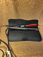 Flat iron resting on heat-resistant pad