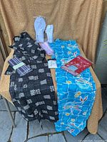 Overview of both kimonos, obis, socks, sash and towel