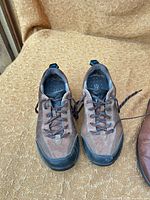 Front view of brown suede Clarks Wave shoes