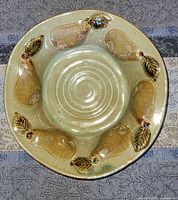 Top view showing entire bowl with pear decorations and spiral center