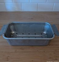 Aluminum pan with trivet inserted