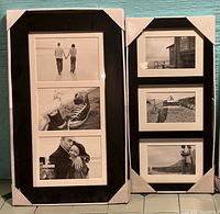 Two new black triple-opening frames in packaging