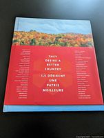 Front view of the hardcover Order of Canada book with bilingual title and landscape cover image