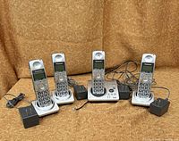 Four Panasonic handsets, base station, chargers, power adapters