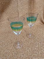 Front view of both wine glasses displaying painted bands