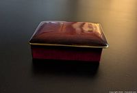 Closed Carlton Ware Rouge Royale box showing red glaze and gilt edge