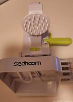 Sedhoom spiralizer front view showing brand logo and spikes