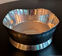 Top view of silverplate bowl showing scalloped rim and interior