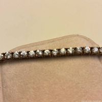 Close-up of diamond line in gold setting