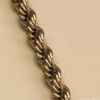 close-up of rope chain links showing gold-tone finish