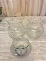 All three vases grouped together showing size differences and rim styles