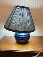 Complete lamp with shade displayed on table