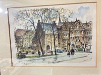 Close view of cityscape print highlighting artwork details and signature area