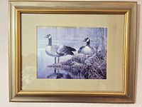 Front view of framed Canada geese print showing frame, mat, and image