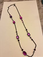 Full view of entire long necklace showing crystal stations and chain