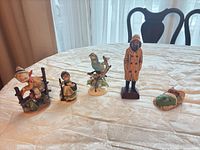 Group shot of all five figurines on table
