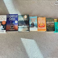 All seven books laid out side-by-side showing front covers