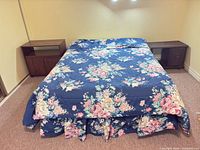 Bed frame with rails flanked by two nightstands