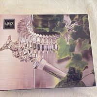 Box lid showing Mikasa branding and photo of stopper in coaster