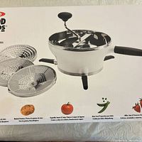 Box front showing OXO Good Grips food mill and three discs