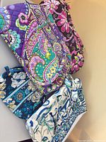 Overview of four Vera Bradley quilted cotton bags in different prints