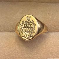 Front view showing crest engraving on oval bezel