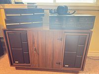 Full view of console cabinet with stereo deck, headphones, cassette storage drawers on top