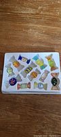 Tray containing 12 assorted glass candies