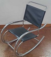 Front angle view showing overall shape, chrome frame, black seat/back