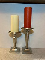 Front view showing both holders with candles