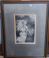 Front view of framed etching showing image, mat, and frame