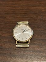 Front view showing dial, case and missing band attachments