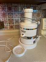 Full view of Jack LaLanne's Power Juicer with cord and removable tray