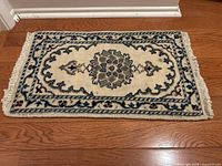 Full view of prayer rug showing design and size