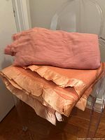 Both wool blankets folded on chair